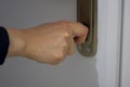 Close up of woman& x27;s hand locking or unlocking the door Royalty Free Stock Photo