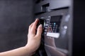 Close-up of a woman& x27;s hand pressing buttons on the control panel of a dishwasher, selecting a mode Royalty Free Stock Photo