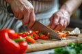 Close up of a woman& x27;s hands holding a knife cut vegetables of a kitchen room. Generative AI Royalty Free Stock Photo