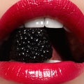 Close-up of woman& x27;s lips with bright fashion red glossy makeup. Macro bloody lipgloss make-up. Red sexy lips Royalty Free Stock Photo