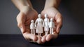 Close up of womans cupped hands showing paper man family, generative ai Royalty Free Stock Photo