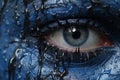 a close up of a womans eye with blue paint on it Royalty Free Stock Photo