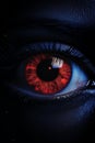 a close up of a womans eye with a red iris Royalty Free Stock Photo