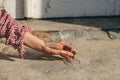 Close-up of womans hand in floral dress holding empty champagne glass in sunlight. New Year, wedding or birthday Royalty Free Stock Photo