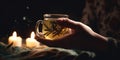 A close-up of a womans hand holding a cup of warm herbal tea, displayed against a soothing, nighttime backdrop, concept
