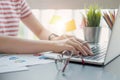 Close up of women or accountant hand holding pen working on calculator to calculate financial data report, accountancy document