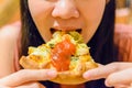 Close-up of a women eating a pizza