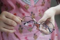 Close up of women hand holding old eyeglass Royalty Free Stock Photo