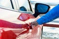 Close up of women hand opening door of car Royalty Free Stock Photo