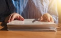 Close up of women hands with stack of paper documents on wood desk Royalty Free Stock Photo