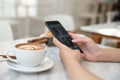 Close up of women hands take a picture coffee in coffee shop