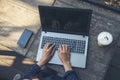 Close up women hands using laptop sitting at coffee shop garden. Top view Freelance woman working type computer keyboard Blank Royalty Free Stock Photo