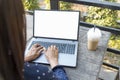 Close up women hands using laptop sitting at coffee shop garden. Top view Freelance woman working type computer keyboard Blank Royalty Free Stock Photo