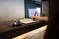 Close up of women putting signing and filling up form at hotel reception