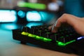 Close up of a women`s hand typing on a gamer