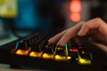 Close up of a women`s hand typing on a gamer