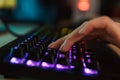 Close up of a women`s hand typing on a gamer