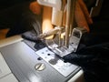 Close up Women`s hands behind the sewing machine and item