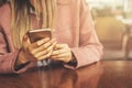 Close up of women`s hands holding cell telephone with blank copy space scree for your advertising text message or promotional Royalty Free Stock Photo