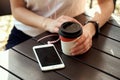 Close up women`s hands holding cup of coffee. Royalty Free Stock Photo