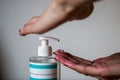 Close up of women`s hands using hand sanitizer gel pump dispenser Royalty Free Stock Photo