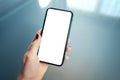 Close up of women`s left hand holding modern mobile phone with blank copy space screen for your advertising text message or Royalty Free Stock Photo