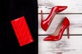 Close up women`s red shoes and wallet. Royalty Free Stock Photo