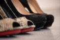 A close up of a women& x27;s shoe, snake leather peep toe and black suede pumps Royalty Free Stock Photo