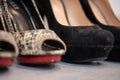 A close up of a women& x27;s shoe, snake leather peep toe and black suede pumps Royalty Free Stock Photo