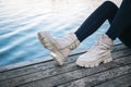 Close-up, women's shoes on the background of the river. Royalty Free Stock Photo