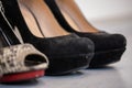 A close up of a womens shoe, snake leather peep toe and black suede pumps Royalty Free Stock Photo