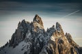 Close up of wonderful snowy rocky mountain range peaks in dolomites, in sunset and blue sky, italy