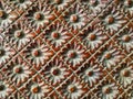 Close up of wood carved flower form pattern.