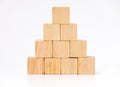 Close up at wood cube arrange in pyramid shape ,business concpt