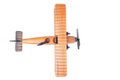 Close up of a wood toy plane seen from the top isolated on a white background Royalty Free Stock Photo