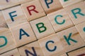 Close up of wooden alphabet tiles focus on letter A B and C
