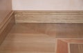 Close up on wooden batten repair on oak wood parquet installation Royalty Free Stock Photo