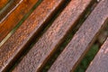 A close up of a wooden bench in the park. close up texture fragment of the wooden bench in the park in fall,top view, diagonal Royalty Free Stock Photo