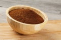 Close up of a wooden bowl of Fresh Ground Coffee