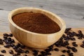 Close up of a wooden bowl of Fresh Ground Coffee