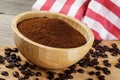 Close up of a wooden bowl of Fresh Ground Coffee