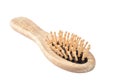 Close-up of a wooden brush for combing hair isolated on a white background. Studio shot from a low angle Royalty Free Stock Photo