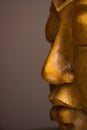 Close-up on wooden Buddha face
