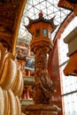 Close-up of wooden carved lamps in Buddhist temple