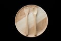 Close up wooden dish ,spoon and fork on black background. Royalty Free Stock Photo