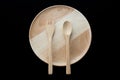 Close up wooden dish ,spoon and fork on black background Royalty Free Stock Photo