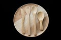 Close up wooden dish ,spoon,fork and knife on black background Royalty Free Stock Photo