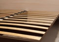 Close-up wooden elements of an arthopedic base of a double bed. Interior structure of furniture Royalty Free Stock Photo