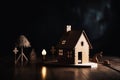 Close-up of a wooden figure of a small one-story house. A miniature statuette made of light wood stands on a table in Royalty Free Stock Photo