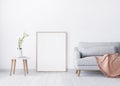 Close up for Wooden frame on white wall background .interior design of living area, Grey sofa with peach plaid ,